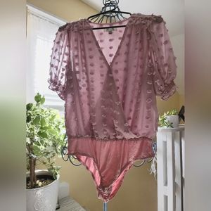 A sheer blousy one piece with texture